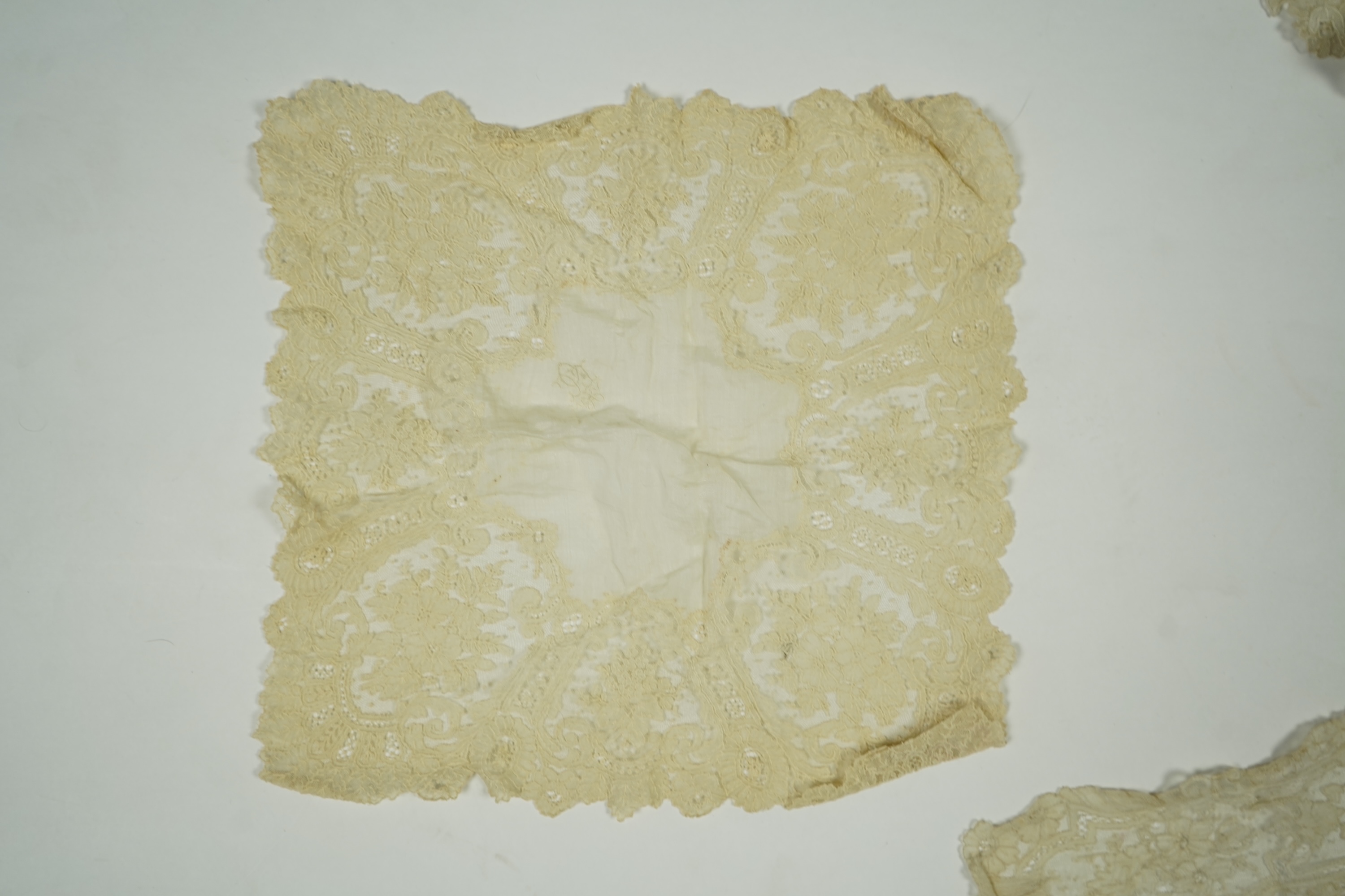 A 19th century Brussels Point de Gaz needle lace collar, lappet and wedding hankie, possibly part of a trousseau. The collar having thirty four needle lace raised flower heads within the design. The collar 100cm long x 1